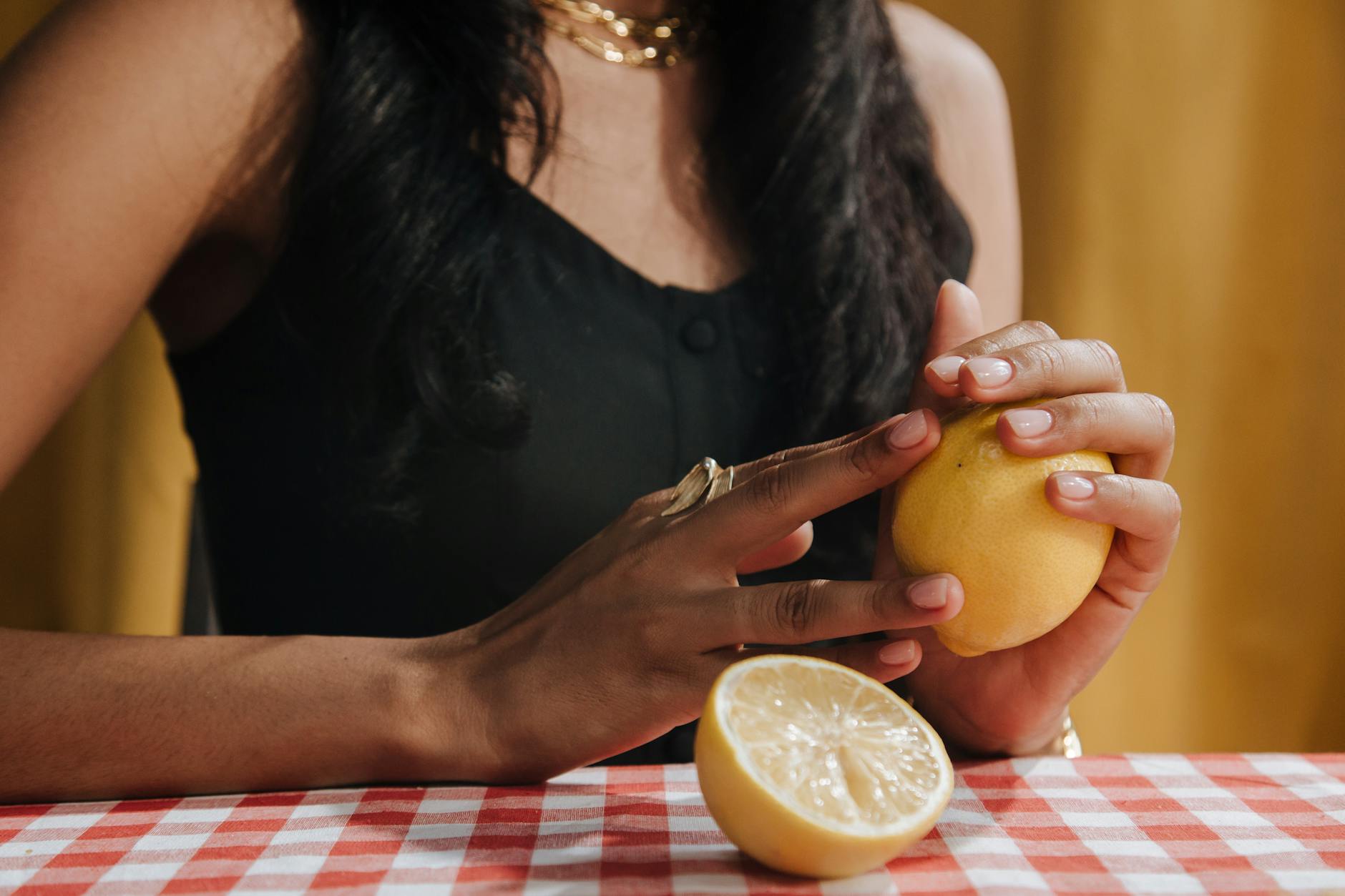 Woman holding fresh lemons, symbolizing rediscovery and vitality in midlife
