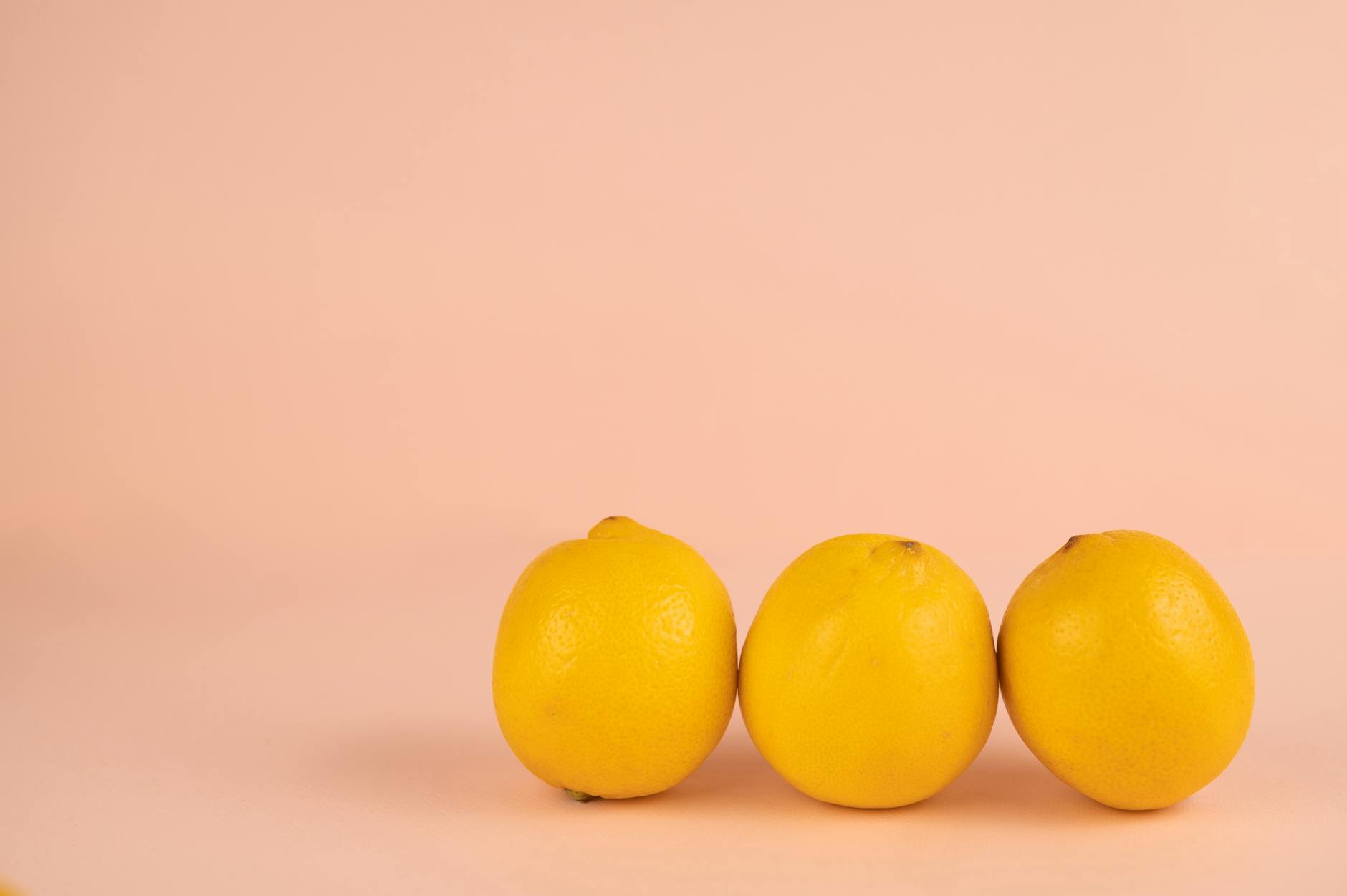 Vibrant sex toys arranged on a bright yellow surface, showcasing diverse designs and colors